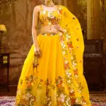 Girl pic showing the yellow lightweight tissue LEHENGA by koskii